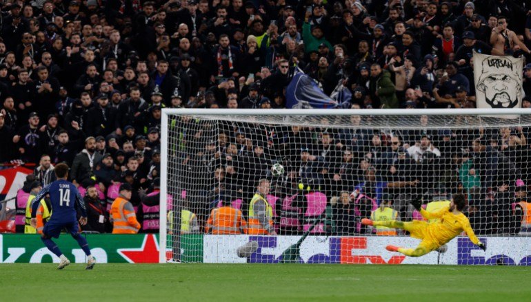 Soccer Football - Champions League - Round of 16 - Second Leg - Liverpool v Paris St Germain - Anfield, Liverpool, Britain - March 11, 2025 Paris St Germain's Desire Doue scores the penalty to win the shoot-out Action Images via Reuters/Jason Cairnduff