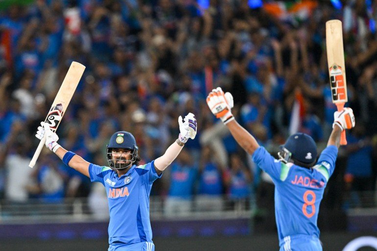 India's KL Rahul and Ravindra Jadeja celebrate their victory during the ICC Champions Trophy one-day international (ODI) final cricket match between India and New Zealand at the Dubai International Stadium in Dubai on March 9, 2025. (Photo by Ryan Lim / AFP)