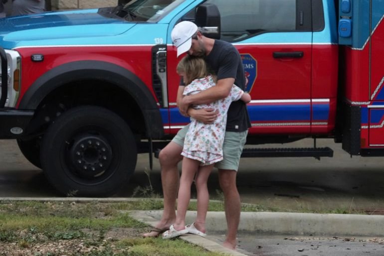 Reunited family members after Texas flash flooding